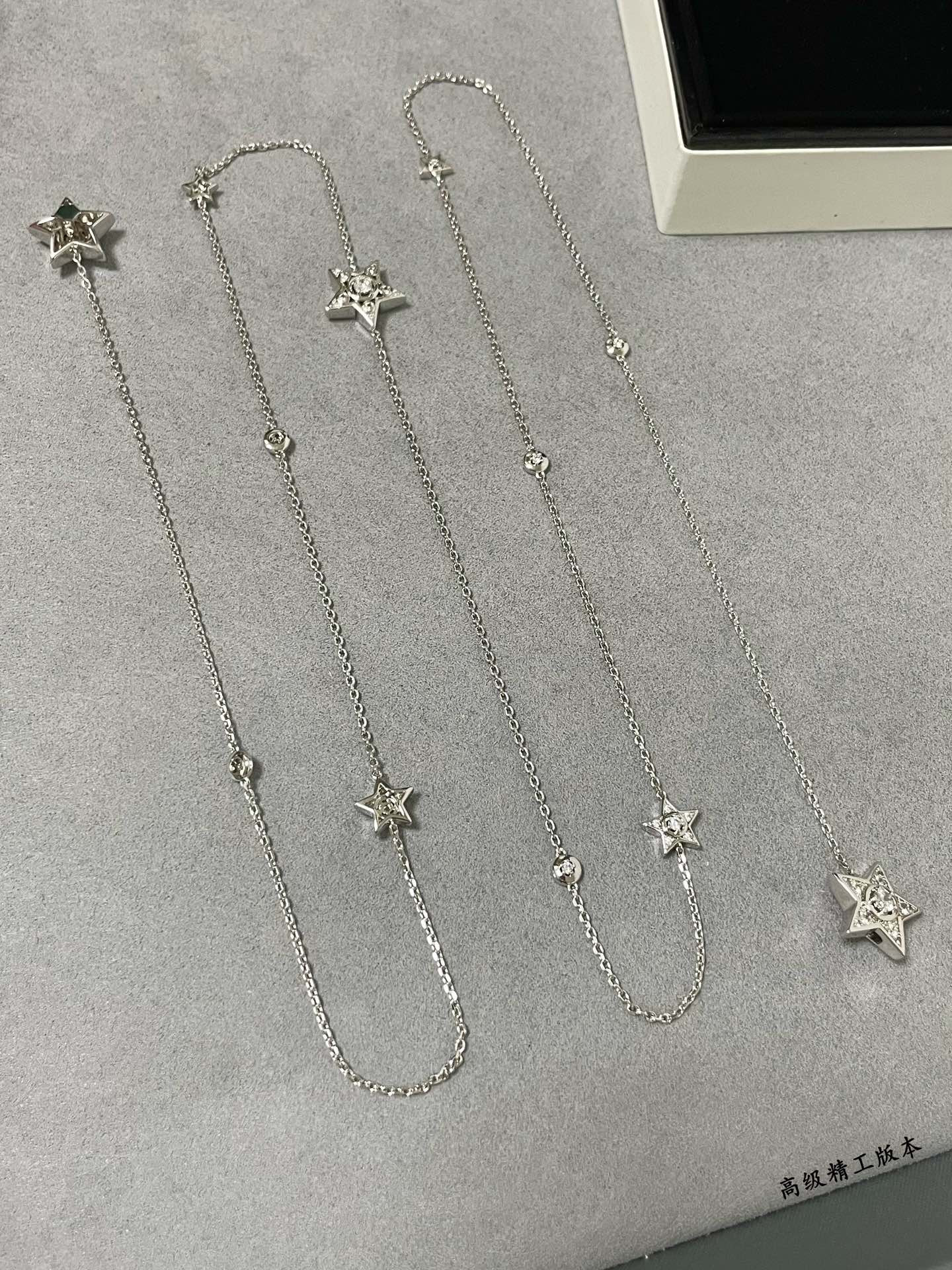 Ch*el star sweater necklace