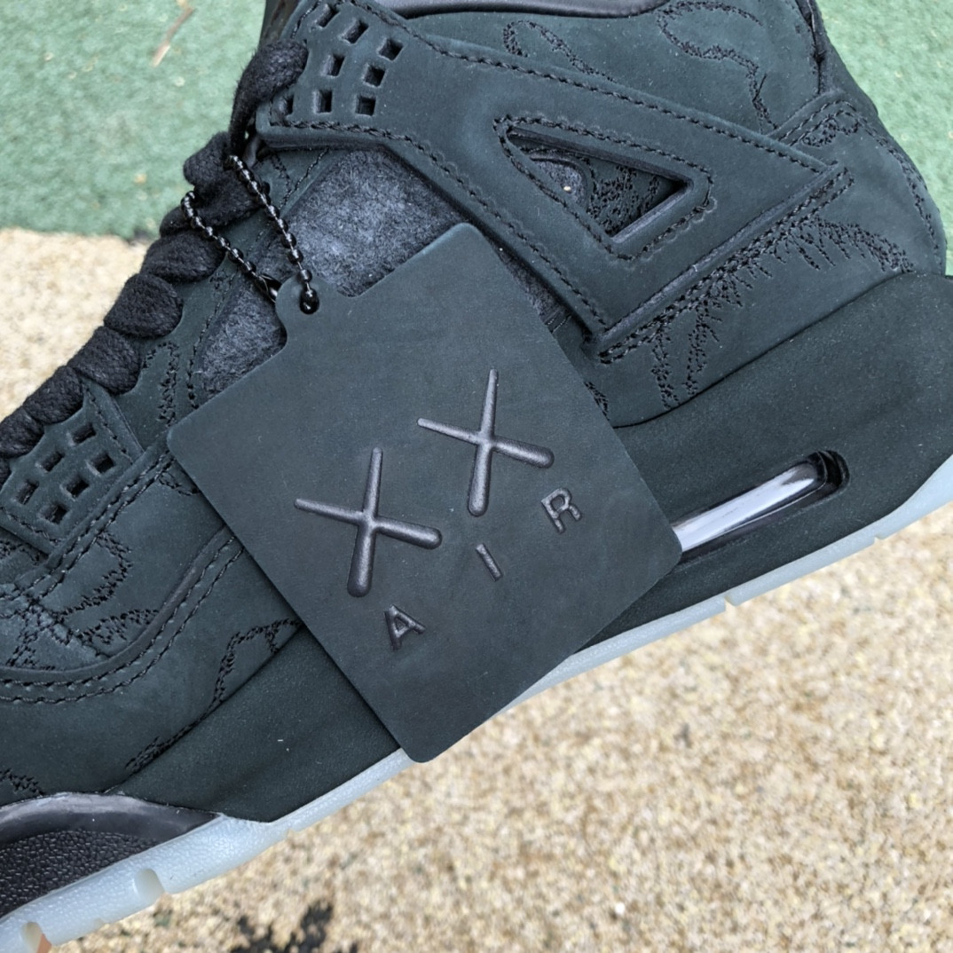 UA Jordan 4 Retro Kaws Black