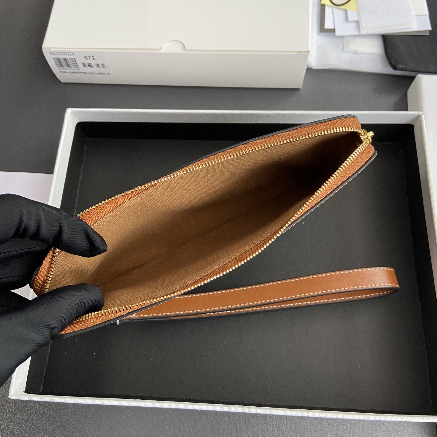 Ce**e long pouch with strap in triomphe canvas and calfskin 21.5x11.5x1cm